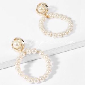 The Chic Petunia Jewelry - Pearl hoop drop earrings. The Chic Petunia Jewelry - Pearl hoop drop earrings.